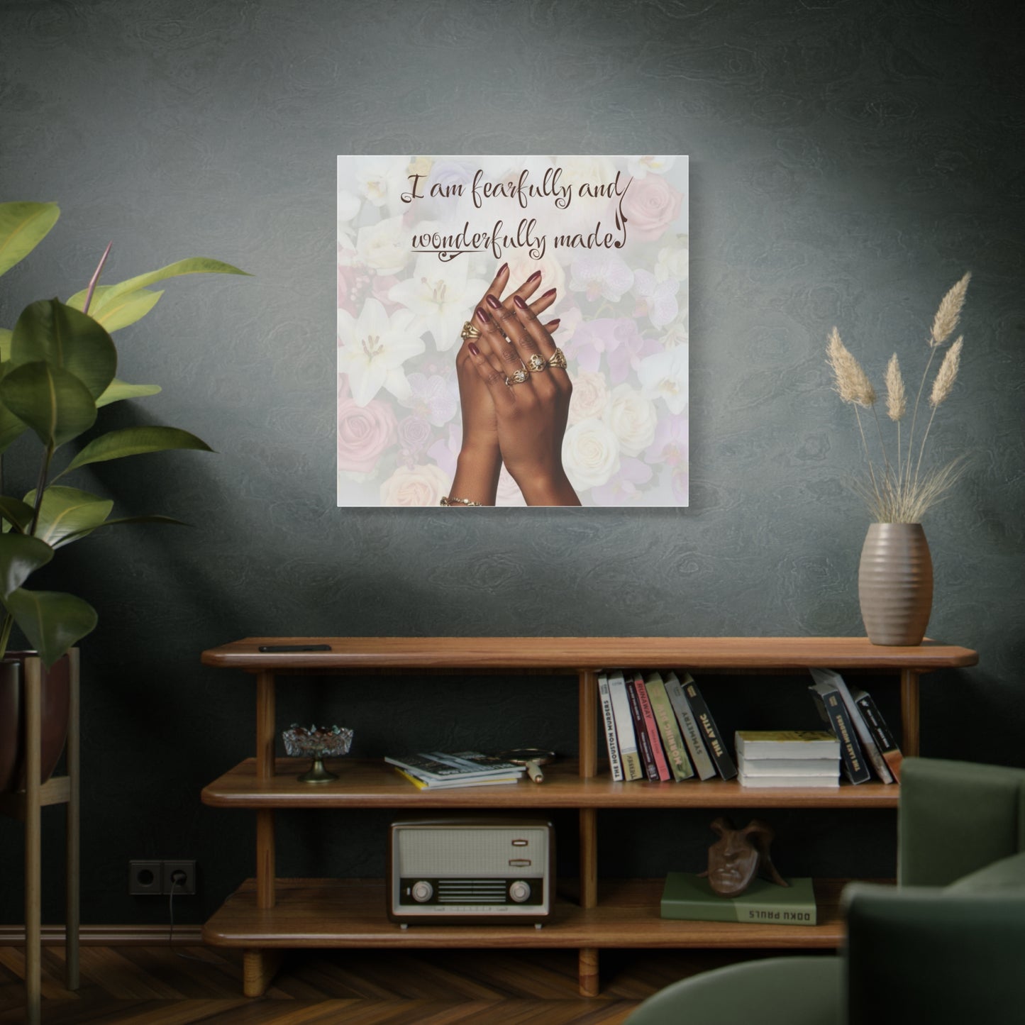 Decorative wall art with hands and text in a living room setting